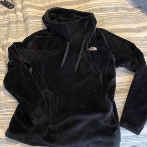 The North Face fleece hooded pullover with front pocket and drawstring hood.
